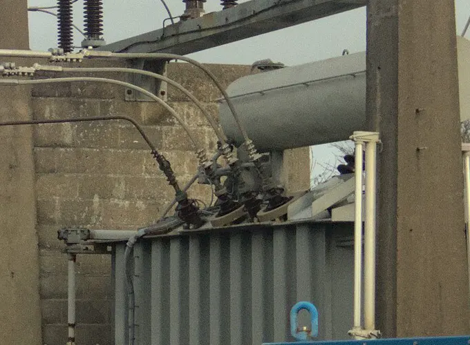 Reconditioned substation transformer, ribbed tank and HV bushings — representative photo